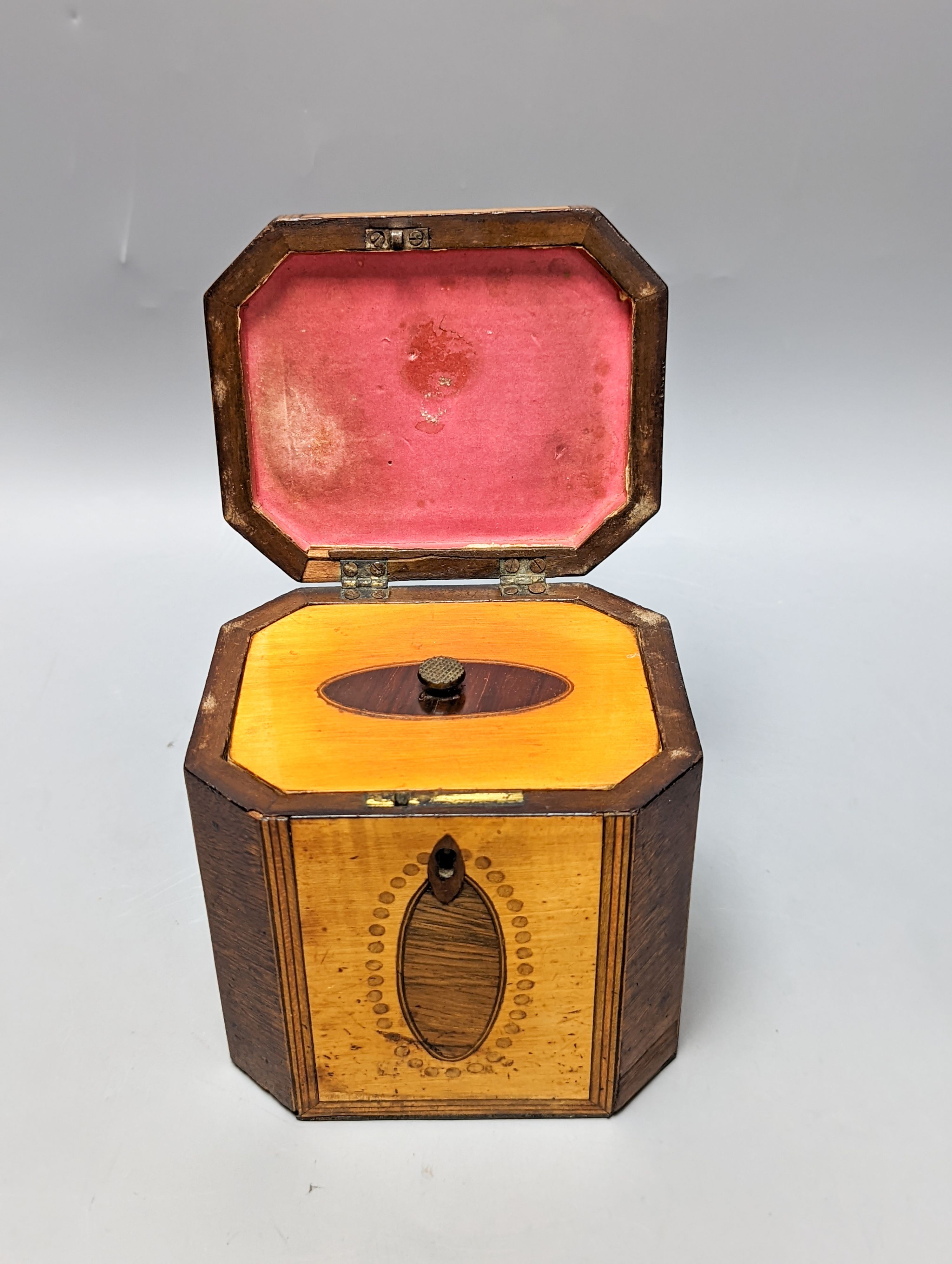 A George III octagonal sycamore and rosewood panelled tea caddy. 13cm